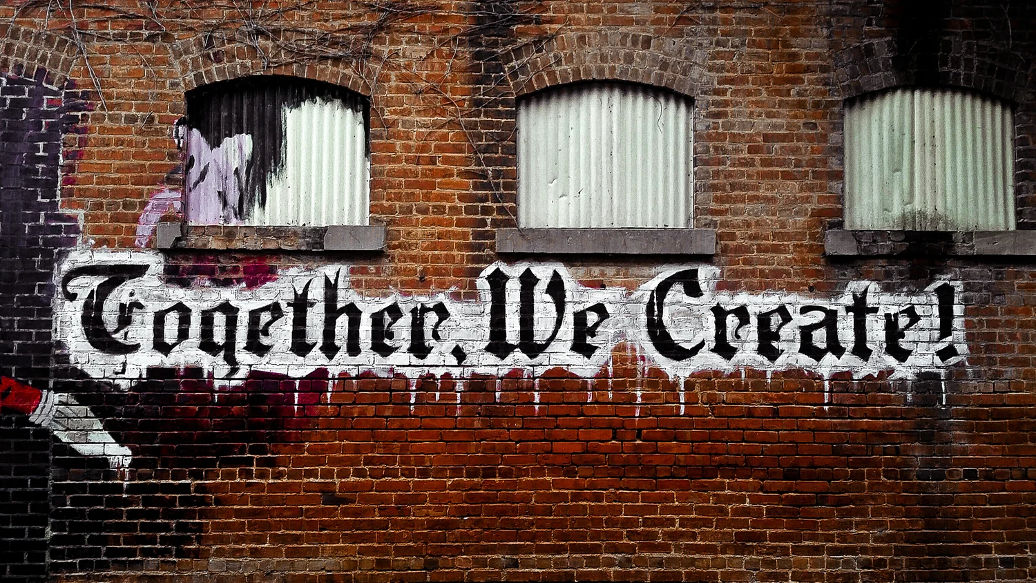 The Together, We Create mural painted on the brick wall at the Sound & Fury shop in Warrenville, IL